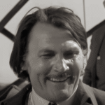 Jack Palance como John, el traficante de armas en Vamos a matar, compañeros (1970).